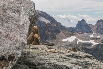 The boots of a relaxing alpine walker