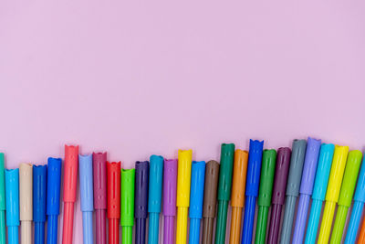 Close-up of multi colored pencils against white background