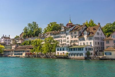 Houses in town against sky