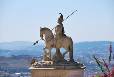 Statue against clear sky