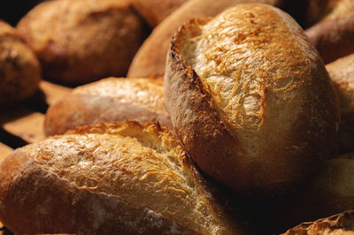 Sourdough bread close-up. freshly baked round bread with golden crust on bakery shelves. the context