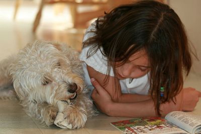 Close-up of girl with dog