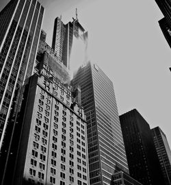 Low angle view of modern buildings against clear sky