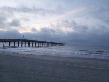 Scenic view of beach against sky during sunset