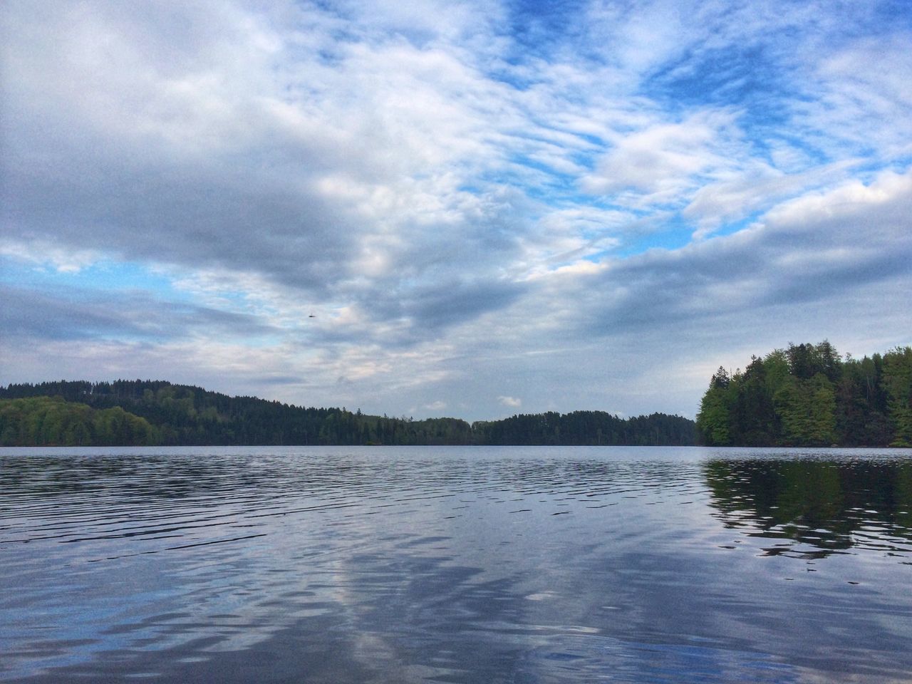 water, sky, tranquil scene, waterfront, tranquility, lake, scenics, cloud - sky, reflection, beauty in nature, tree, cloud, nature, cloudy, rippled, idyllic, river, calm, outdoors, non-urban scene