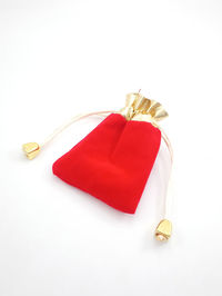 High angle view of red heart shape on white background