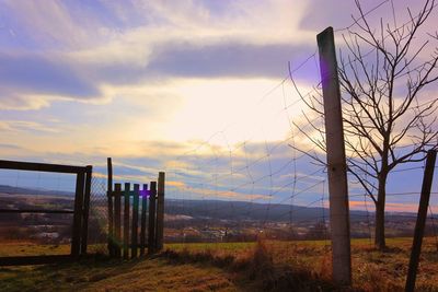 Scenic view of field against sky during sunset