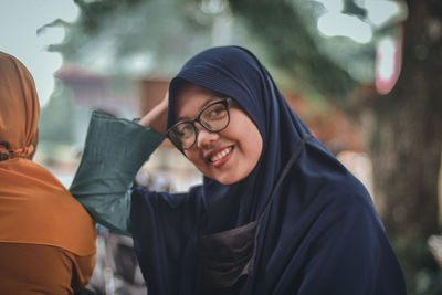 Portrait of smiling young woman