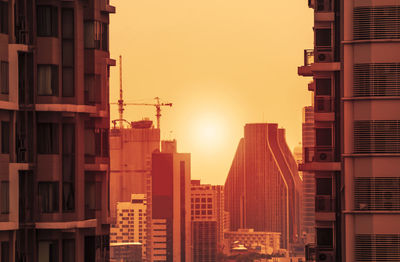 View of skyscrapers at sunset