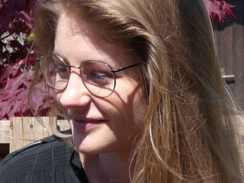 Close-up portrait of woman wearing eyeglasses