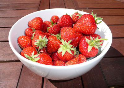 High angle view of strawberries in bowl on table