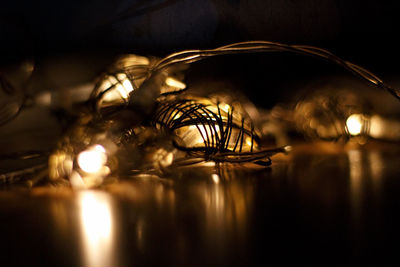 Close-up of illuminated lights on table at home