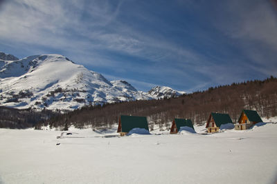 Scenic view of snowcapped mountains against sky