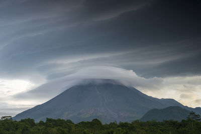 Scenic view of volcanic mountain against sky