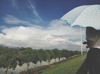 Scenic view of field against sky during rainy season