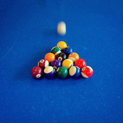 Close-up of pool balls on blue table