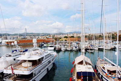 Boats moored at harbor