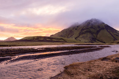 Scenic view of landscape against sky during sunset