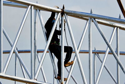 Low angle view of metallic structure against sky