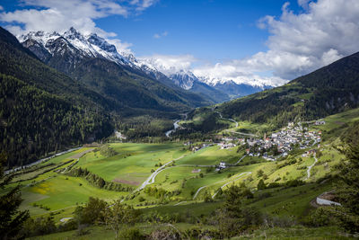 Scenic view of landscape against sky ramosch, schweiz 