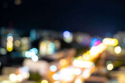 Defocused image of illuminated lights at night