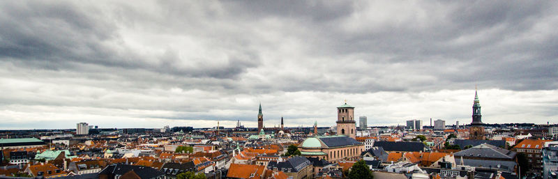 Houses in town against sky