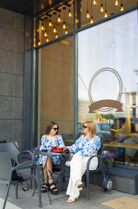 Rear view of woman sitting in restaurant