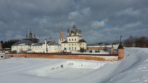 Panoramic view of buildings against sky during winter