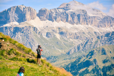 Rear view of people on mountain range