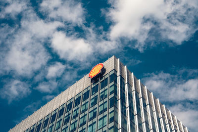 Low angle view of building against cloudy sky