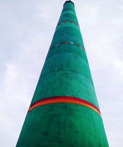 Low angle view of tower against cloudy sky