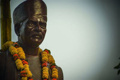 Low angle view of statue against sky