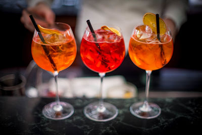 Close-up of wine glasses on table