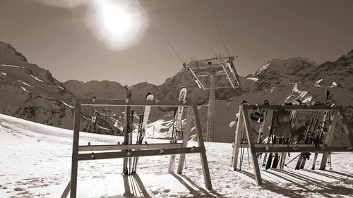 Sun shining through clouds over mountains