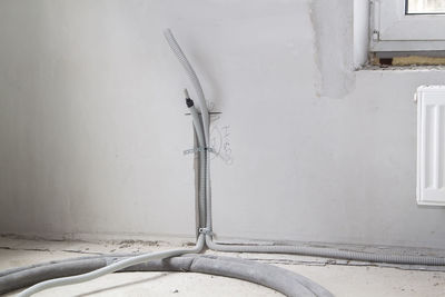 Metallic structure against wall in old building