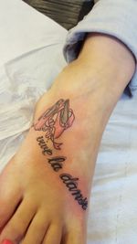 Low section of woman wearing shoes