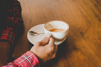 High angle view of coffee cup on table