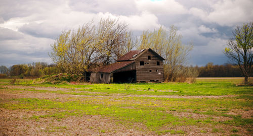 House on field against sky