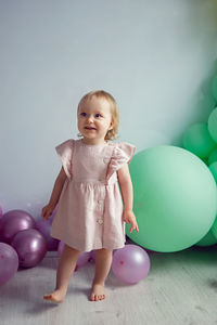 Portrait of cute girl with balloons