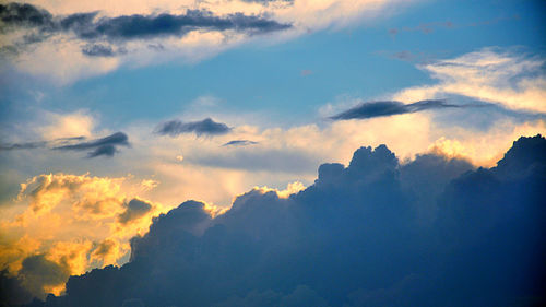 Low angle view of clouds in sky during sunset