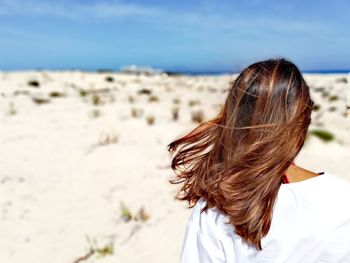 Rear view of woman at beach