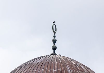 Low angle view of dome of mosque against clear sky