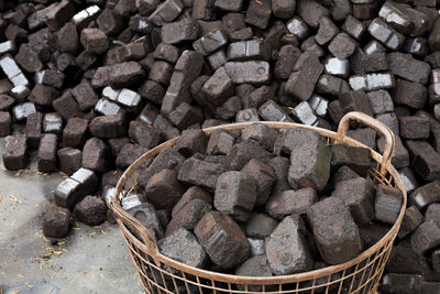 Closeup view of black charcoal, coal briquets. energy resource, heating, industrial use.