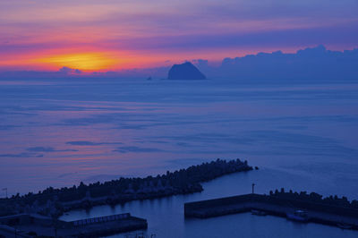 Scenic view of sea against sky at sunset