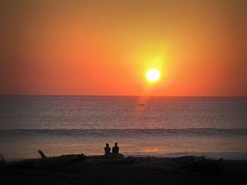 Scenic view of sea at sunset