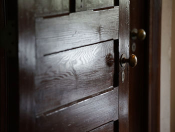 Old wooden door at the entrance of the room