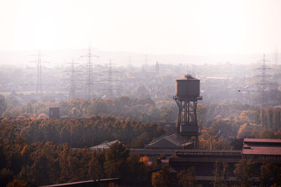 Water storage tank amidst trees