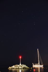 Illuminated building against sky at night