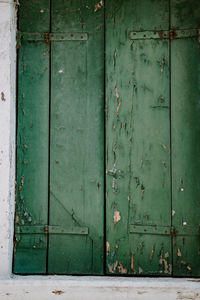 Closed weathered door of old building