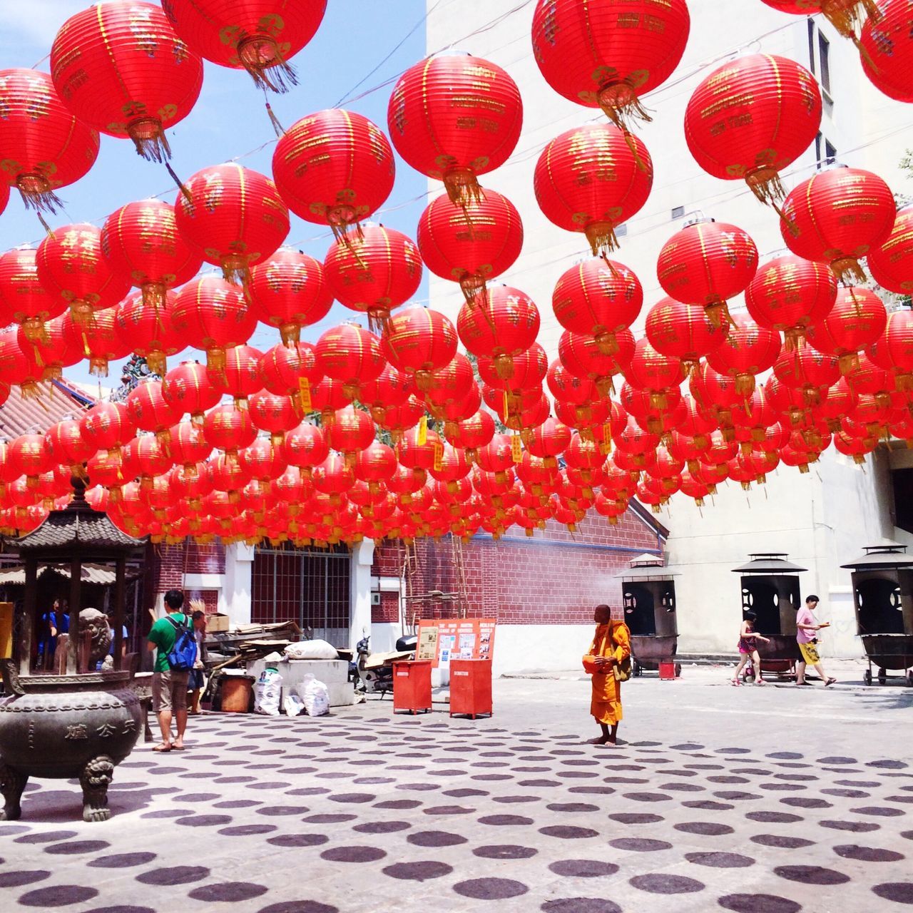 decoration, hanging, architecture, red, built structure, lantern, person, building exterior, men, celebration, lighting equipment, large group of people, cultures, street, retail, in a row, lifestyles, tradition, traditional festival